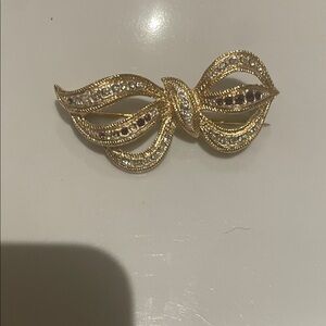 Gold-Tone Bow Brooch with Clear and Ruby-Like Stones